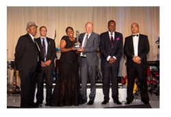 G.U.D.Holdings:Red Shuttleworth, G.U.D. Holdings (4th left) accepts the award with joint winner Nosipho Siwisa-Damasane, Chief Executive of Richards Bay Coal Terminal. 