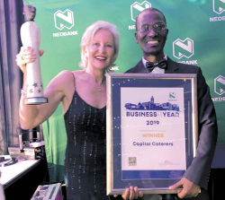 Merrill King and Russell Nzimande receive the coveted Nedbank PMCB Business of The Year Award