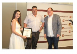 Corobrik - Amy Thompson receiving her award from Christie van Niekerk of Corobrik, right is Dr Julian Raxworthy from the University of Cape Town