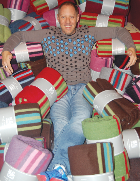 East Coast Radio's Damon Beard surrounded by a sea of blankets that have been