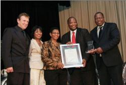 Sharing centre stage at the award ceremony are Grant Adlam and Lalita Dhasiar-Ventura - both KZN Top Business, Elizabeth Maepa - FNB, Sbu Zondi - RBM and Michael Mabuyakhulu - KZN MEC for Economic Development and Tourism